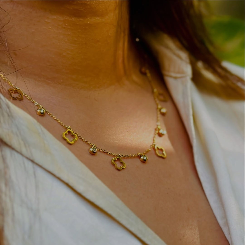 A minimal yet stunning neck chain adorned with clove charms and delicate stones – perfect