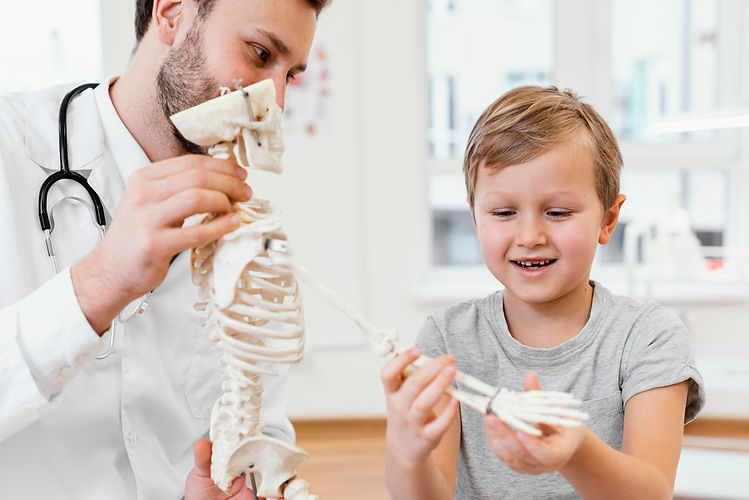 close-up-doctor-kid-with-skeleton.jpg