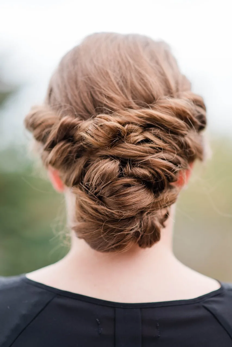 Back view of a women with a beautiful updo hair by Casa artist in Scarborough and North York