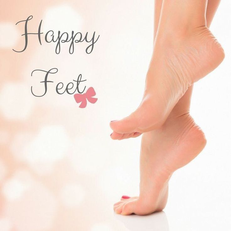 Close-up of clean, soft feet on tiptoes with the text "Happy Feet" and a pink bow on a light, blurred background.