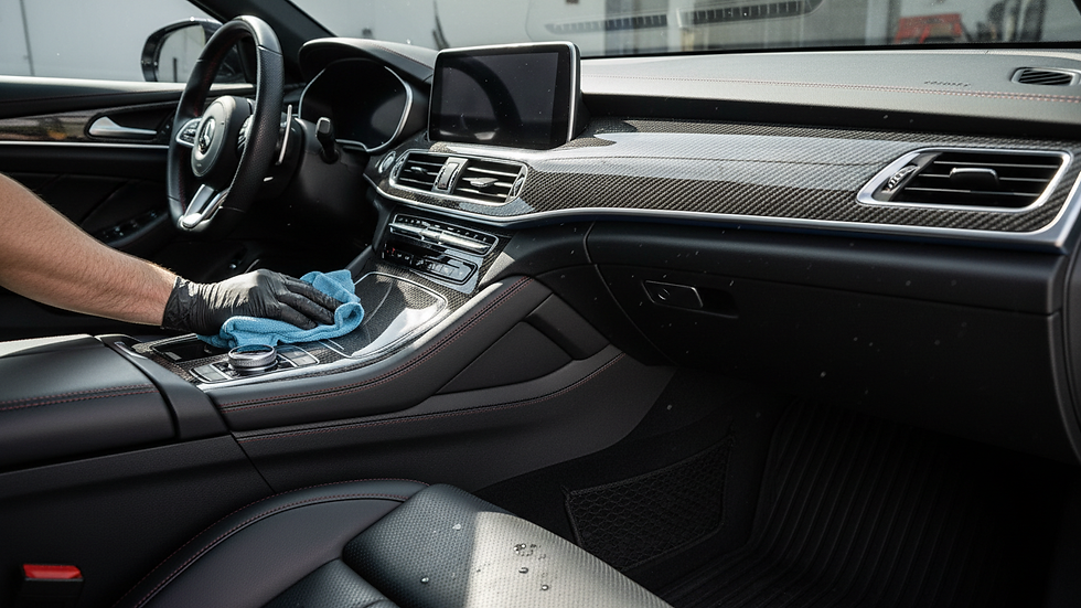 Close-up view of a car interior being professionally cleaned and detailed