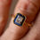 Thumbnail: Close up view of Art Deco style sapphire and diamond cluster ring.