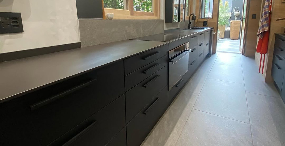 Matt‑black and French white oak kitchen cabinetry