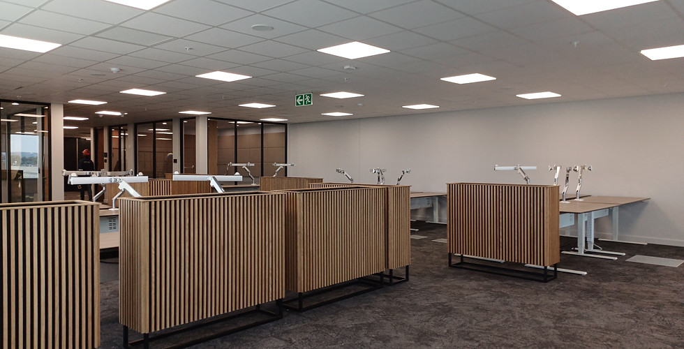 Bespoke oak slatted partition — commercial interior