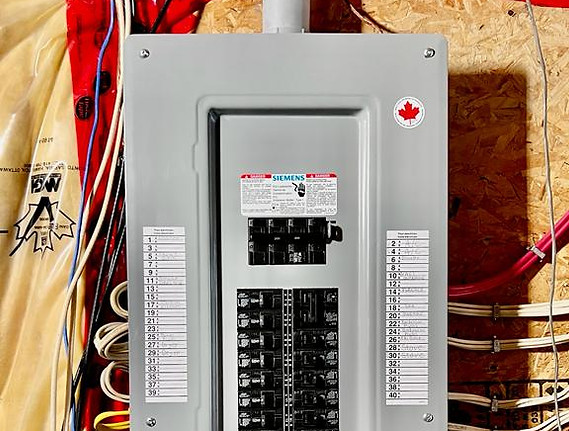 Behold the power upgrade! Witness the installation of a robust 200 Amps electric panel on the wall. Our skilled electricians ensure a seamless and efficient upgrade, providing your space with the capacity to meet increased electrical demands. Choose Rising Electric Services for reliable and professional electrical solutions.