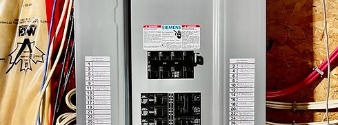 The picture showcases a 200-amp electrical panel, which is the heart of your electrical system. It features various circuit breakers and wiring connections, ensuring a safe and efficient distribution of electricity throughout your home or business. The panel represents a reliable and robust electrical infrastructure, capable of meeting increased power demands and providing ample capacity for your electrical needs.