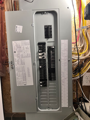 A neatly installed 200 Amps electric panel on a wall, showcasing its sleek and modern design