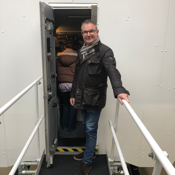 Customer boarding the JetEx Boeing 737 flight simulator at Frome, Somerset