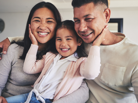 A happy family within their home.