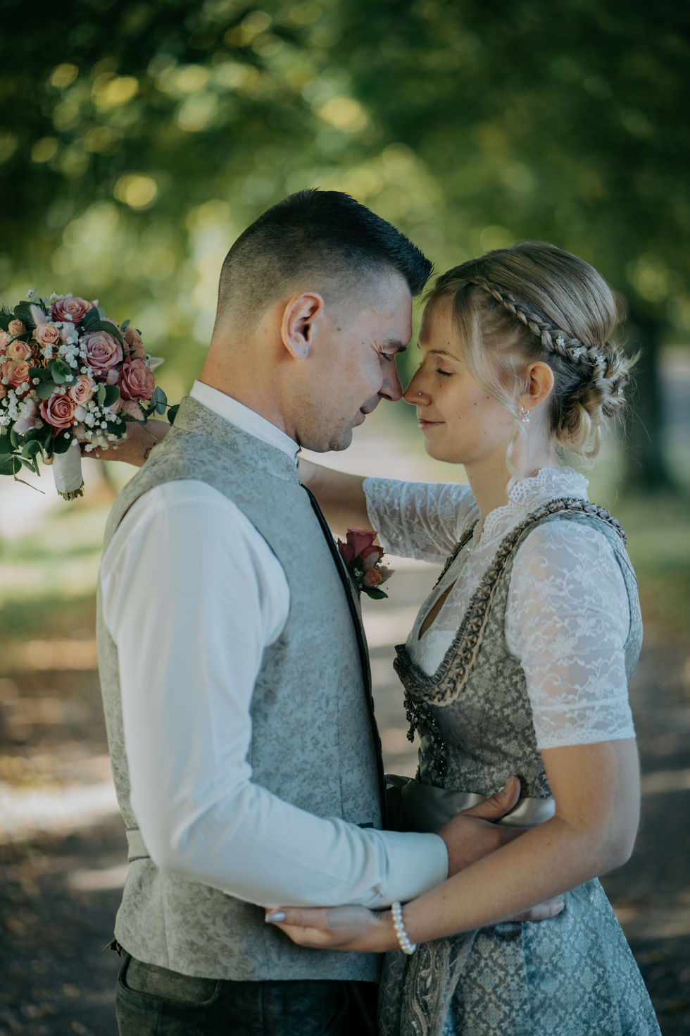 a bride and groom looking into each other 's eyes