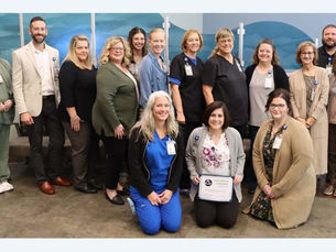 Clay County Medical Center staff members pose with the 2024 Performance Leadership Award for excellence in Patient Perspective from The Chartis Center for Rural Health.