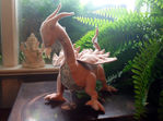 pink felt dragon with lace, beaded, and embroidered accents