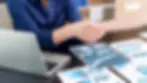 Two professionals shaking hands during meeting