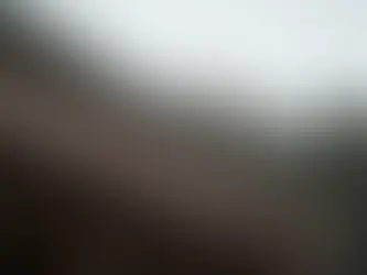 Rainwater dripping from a roof during a storm.