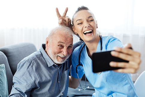 Doctor or nurse caregiver helping senior