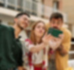 A group of friends in a joyful mood and enjoying life- 2 male and a female clicking picture.