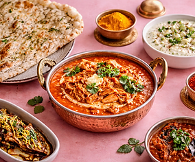Delicious Indian feast with butter chicken.png