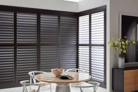 Heritance Wood Shutters deliver an automated light control solution that represents the ultimate in premium craftsmanship for this Aurora CO bedroom from BCC.;
