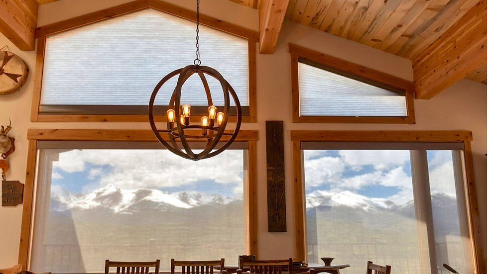 Breathtaking snow-capped mountain views framed by uncovered upper trapezoid windows beneath a vaulted wood ceiling in Parker CO — BCC of Denver Colorado.; Blind Corners & Curves specializes in motorized convenience for customers in Aurora, Durango, and Breckenridge.; 