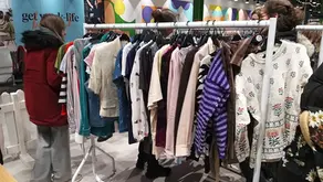 A clothes rail full of garments to swap. 