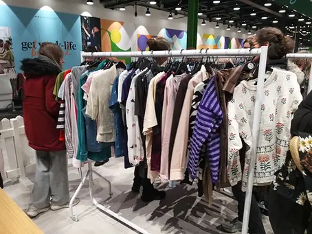 A clothes rail full of garments to swap.