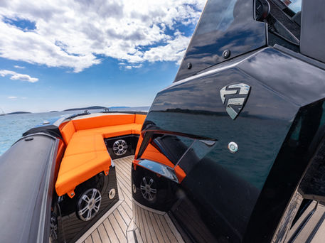 Close up of a black and orange SuperRIB boat