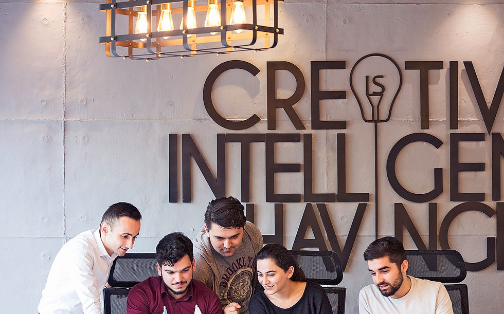 Creative digital marketing team collaborating on an SEO strategy and website growth project in a modern office.
