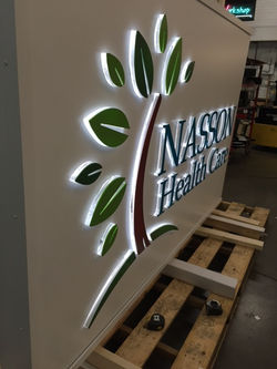 Single-sided illuminated cabinet with push-thrus