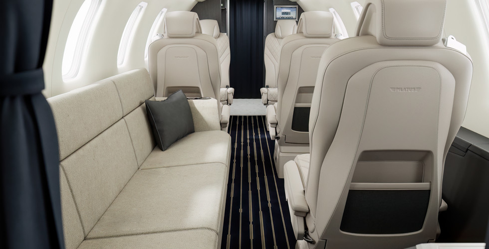 The couch feature in the Pilatus PC-24 cabin, designed for relaxation and maximizing in-flight comfort. Ideal for private aircraft charters in Monterey and beyond.