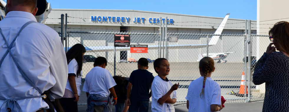Seaside Boys and Girls Club members enjoying a memorable day at the Monterey airport event with MPI Jet.