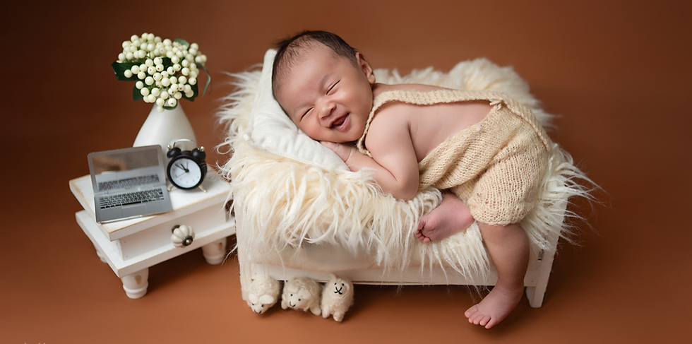 Close-up view of a newborn baby wrapped in a soft blanket