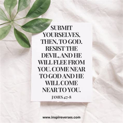 White card with a Bible verse from James 4:7-8 on a crumpled fabric surface, with green leaves. Calm and inspirational mood.