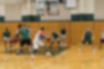 Basketball camp players competing