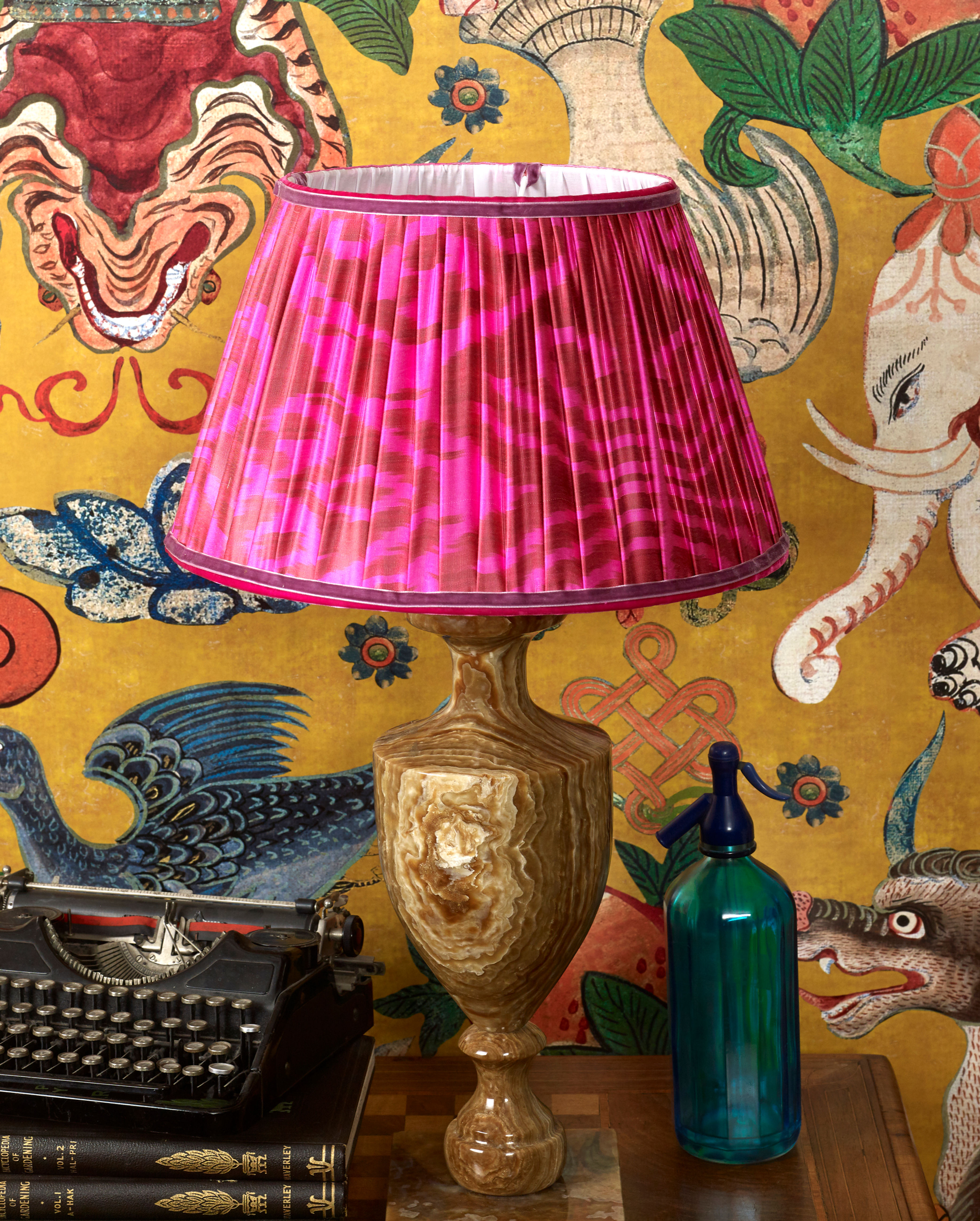 Maximalist interior design, handmade pink silk ikat lampshade in yellow patterned wallpapered room