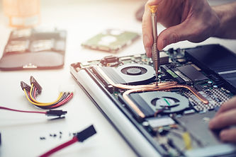 technician repairing laptop computer closeup.jpg
