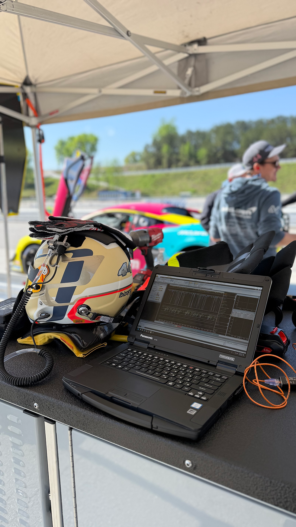 Car engine being diagnosed for electrical programming during on-site service