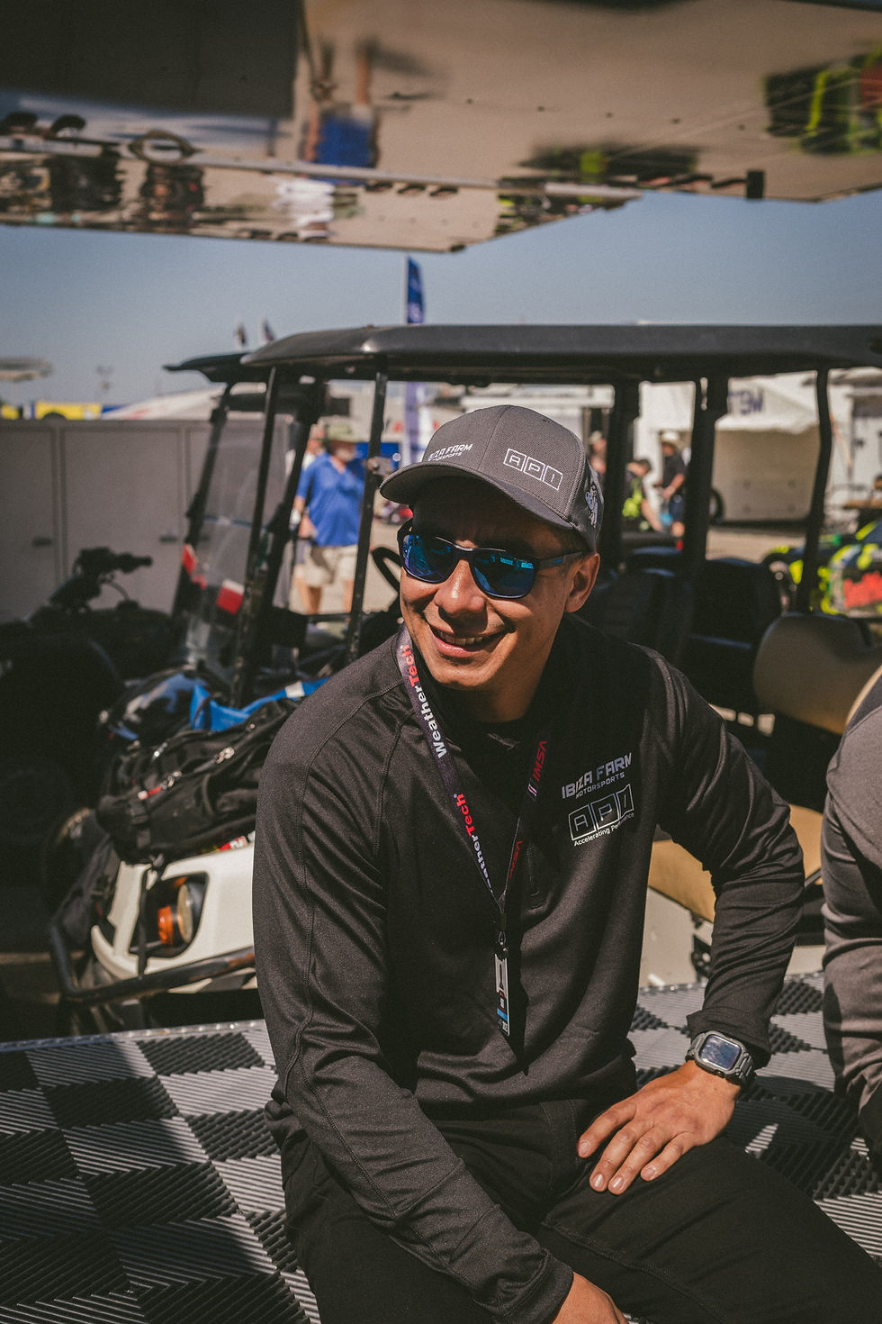 Automotive technician performing mobile car diagnostics and electrical programming