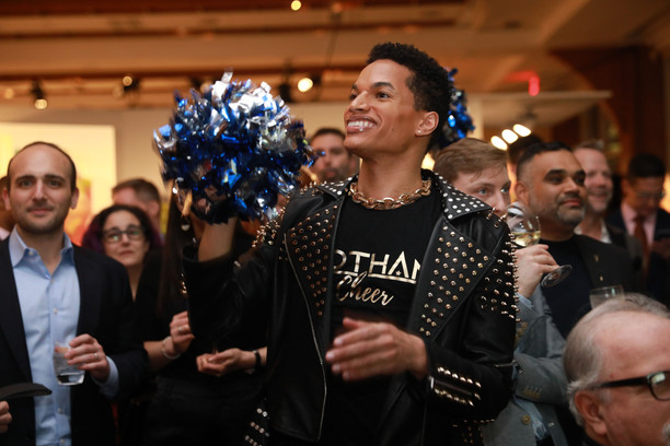 Gotham Cheer Cheerleader at Bailey House Gala event with Pom Poms