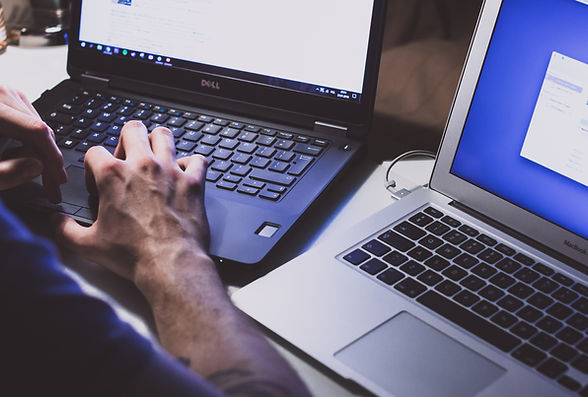 Man using a Laptop.
