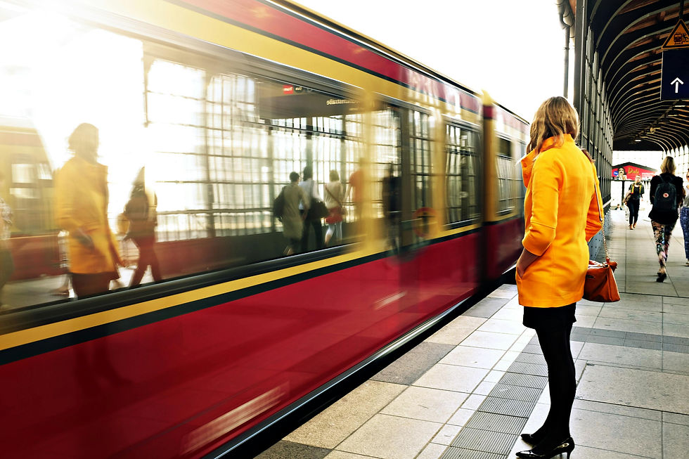 A woman standing in front of a moving train.
Photo by Life Of Pix: https://www.pexels.com/photo/woman-standing-beside-red-train-21410/