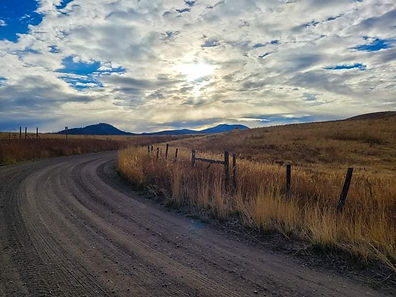 Jim B road with clouds.jpeg