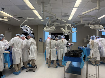 physicians in a cadaver lab wearing PPE