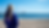 Back view of Gemma wearing her Gemma Walton Marketing branded hoodie with logo, standing on the beach and looking out to sea. Illustrates use of brand colours and logo placement in professional photography.