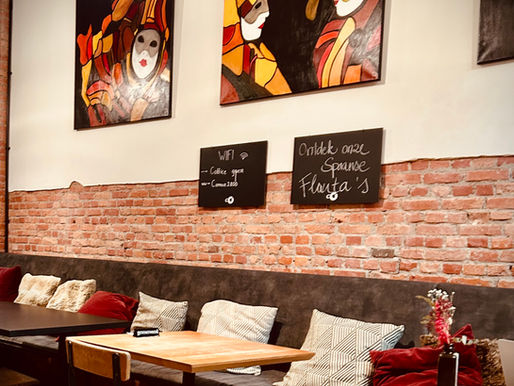 Coffice café in Mechelen with specialty coffee, baristas preparing OR Coffee on a La Marzocco espresso machine in a stylish urban interior.