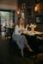 Sasha Alexander holding a coffee