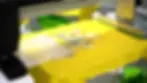 The ROQ PEEL peeling a transfer on a yellow tshirt