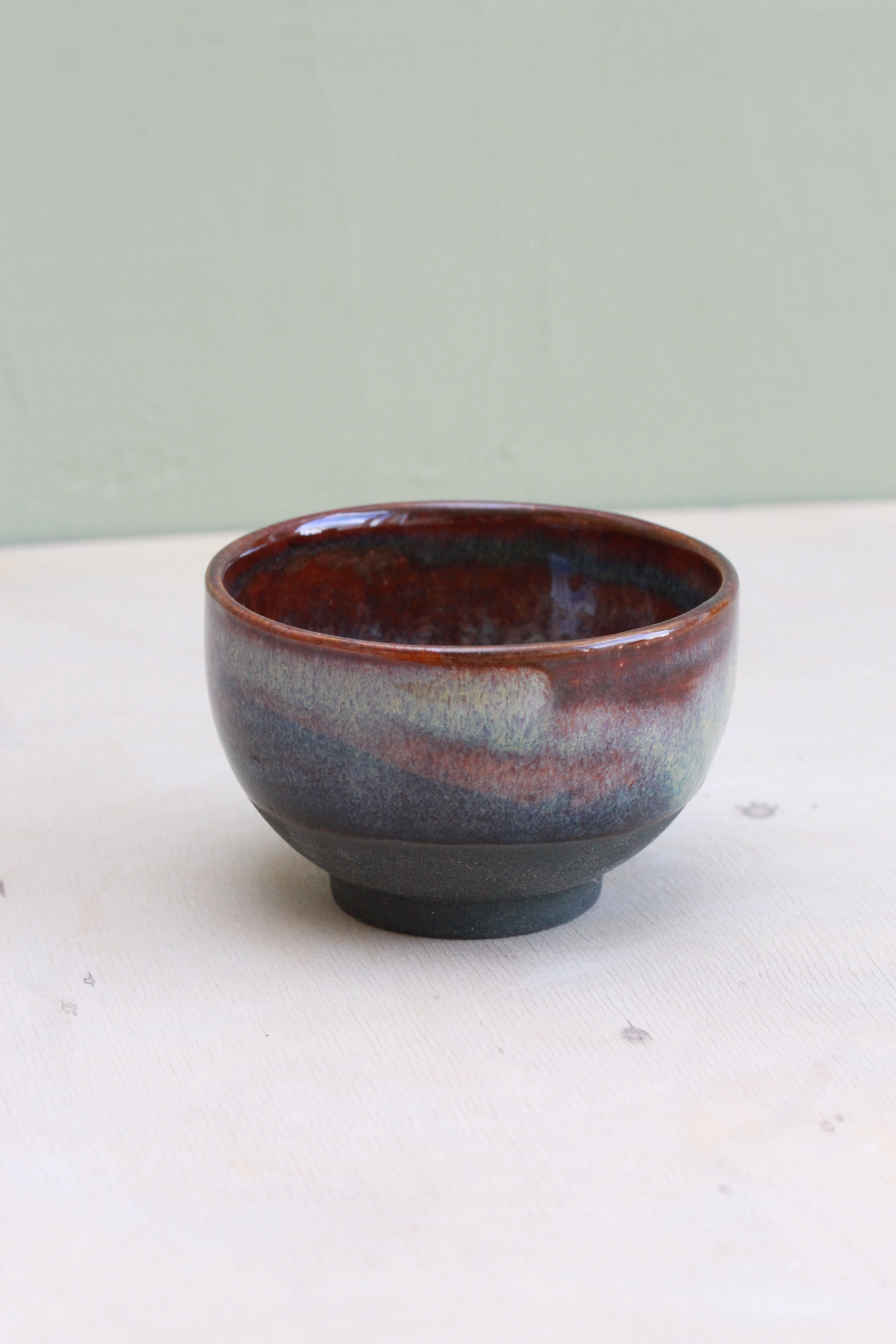 HANDMADE STONEWARE JAPAN CUP RED BLACK BOTTOM
