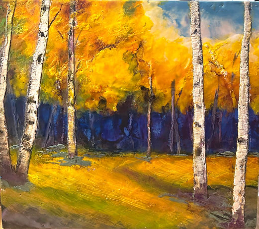 Autumn landscape of birch trees with oranges and yellows. Dark blue and purple shadows in the distance.