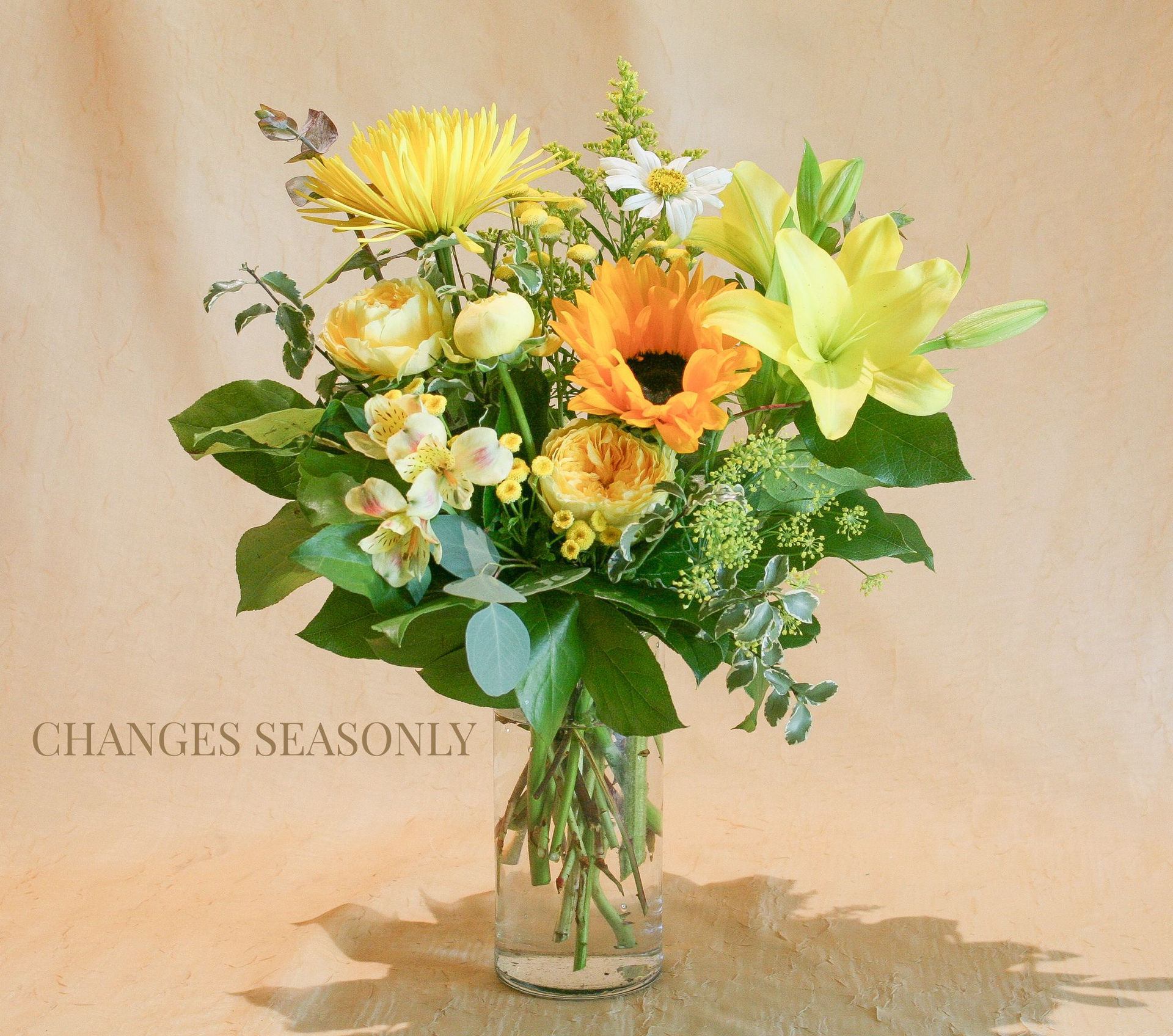 Yellow flower arrangement, exclusively at G Rossi Florist. This floral design will be different and unique every time