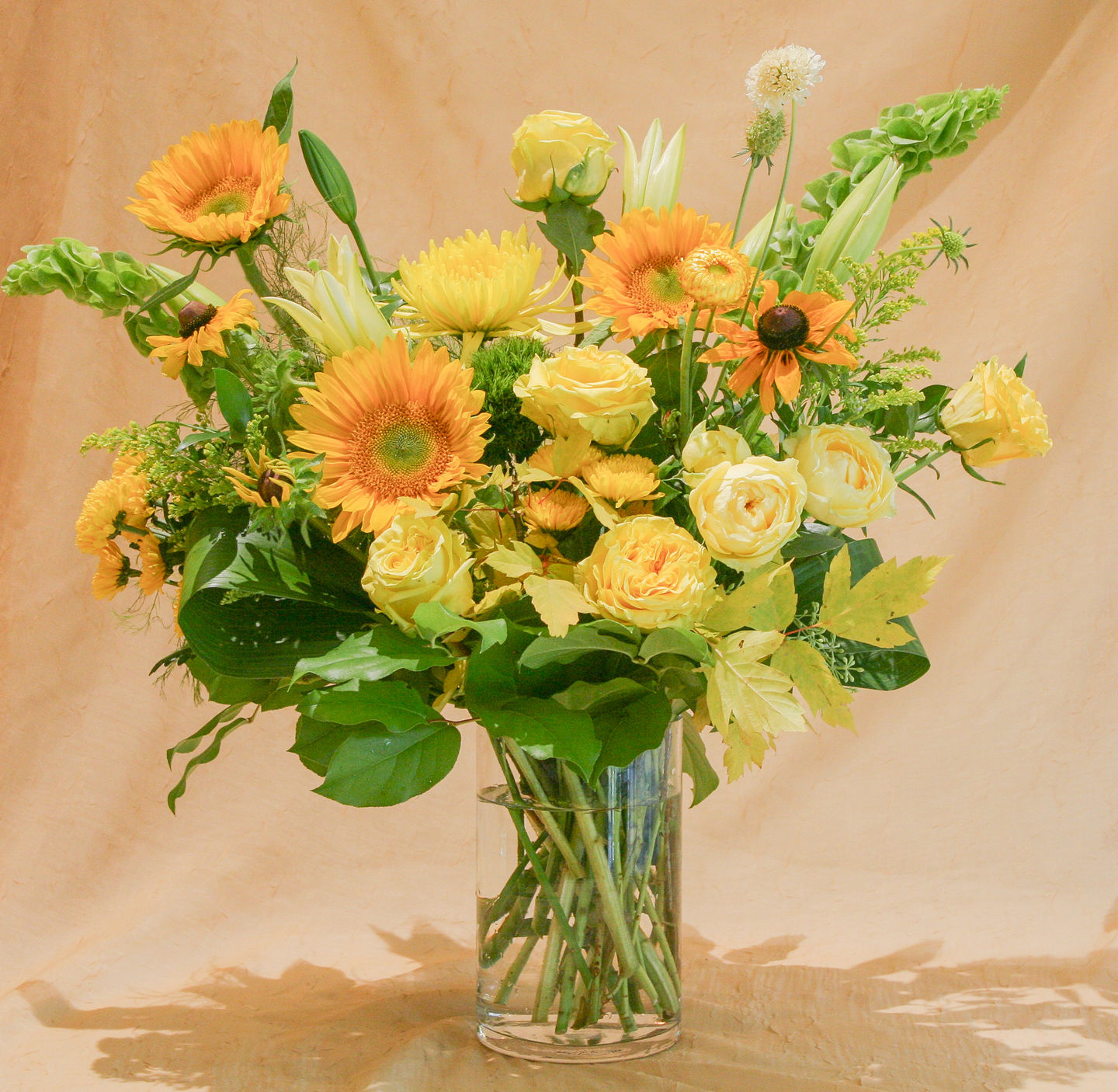 Yellow flower arrangement, exclusively at G Rossi Florist. This floral design will be different and unique every time